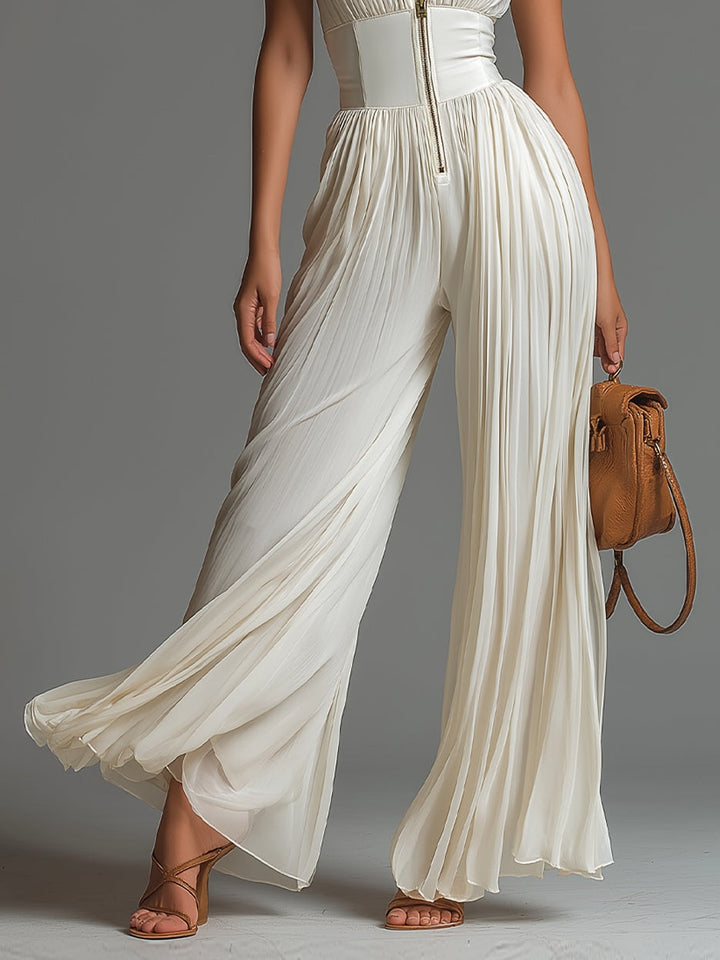 Tutina in chiffon senza maniche con scollo a V, zip e pantaloni a gamba larga